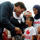 Shaking hands with a Syrian refugee child on Canada Day.